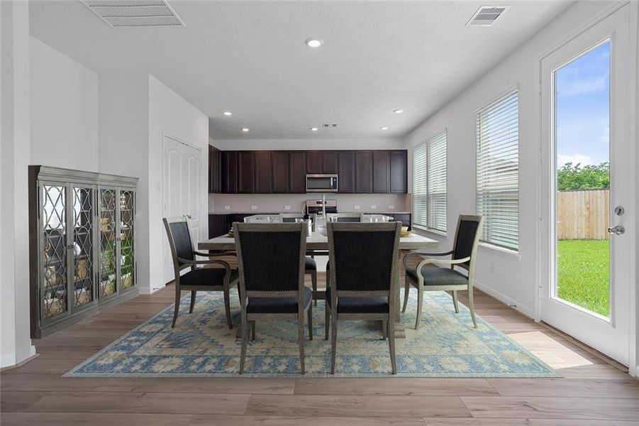 Start your day off right with a cup of coffee sitting with your family in the lovely breakfast area! Featuring large windows, custom paint, tile flooring, recessed lighting and large windows with privacy blinds.