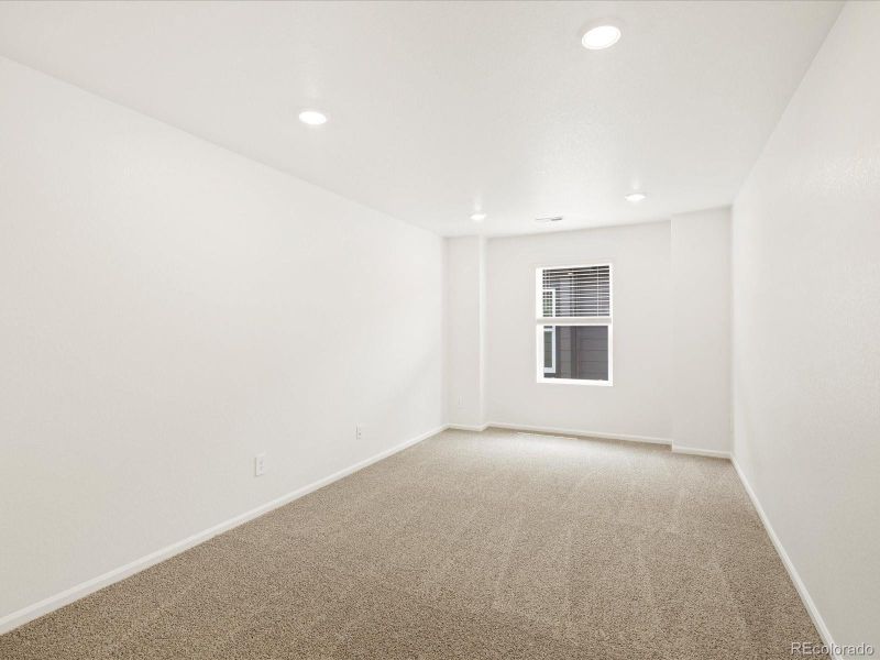 Spacious, unfurnished interior of a new home in Ridgeline Vista: The Flora Collection, Brighton (Image 32).