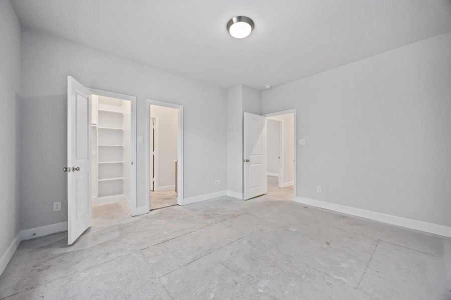 Calm, bright, and generously proportioned, this secondary bedroom feels airy and grounded at the same time—an easy retreat with great natural light and room to truly unwind.