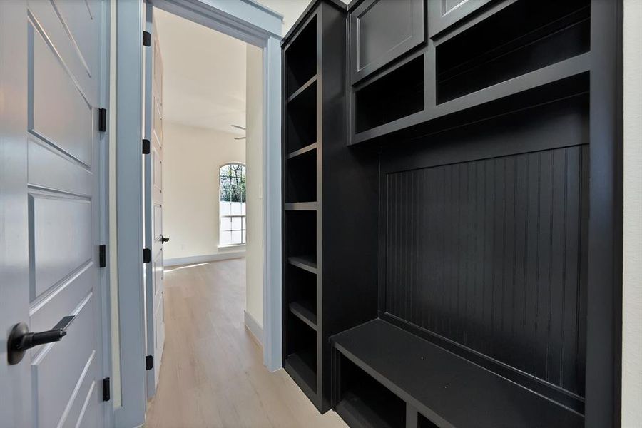 Mudroom featuring light wood finished floors
