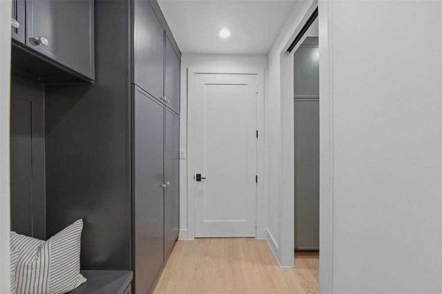 Functional mudroom connects the main living spaces with the pantry and garage for streamlined daily living.