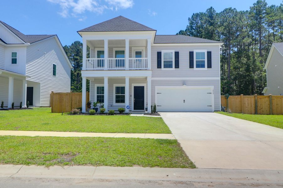 Exterior details and patio area of a home in Sweetgrass at Summers Corner: Arbor Collection, Summerville (Image 23).