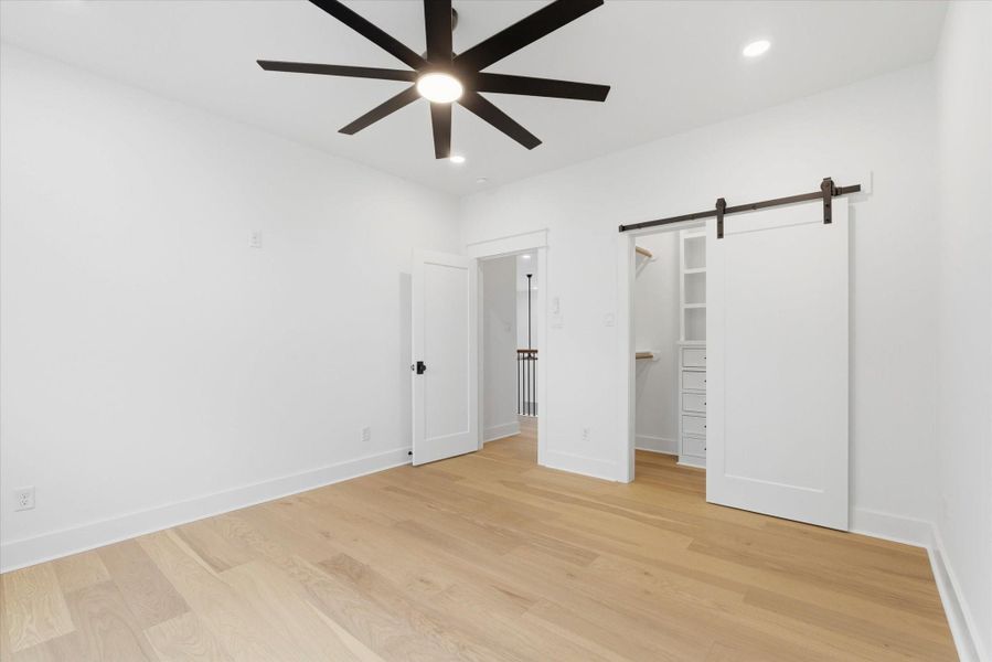 All secondary bedrooms feature spacious walk-in closets with ample hanging space and built-in drawers.