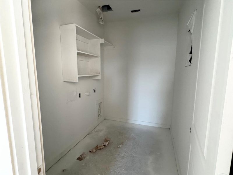 Bathroom featuring unfinished concrete floors and baseboards Bathroom featuring unfinished concrete floors and baseboards