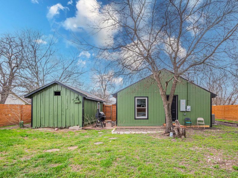 View of shed featuring a fenced backyard