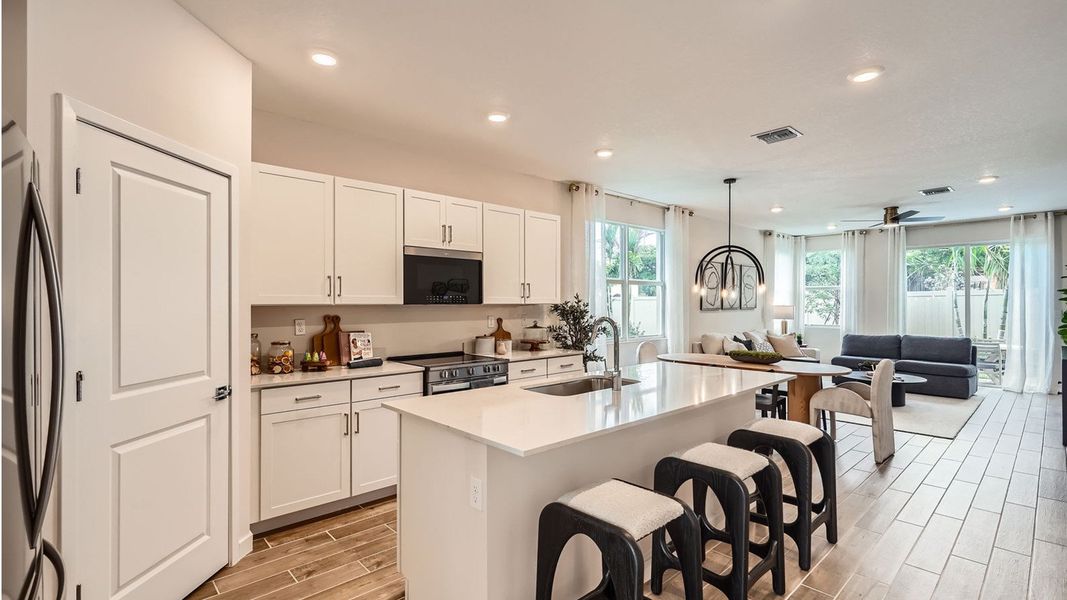 Representative furnished interior of a home built from the Grandcourt by D.R. Horton in Parker Pointe, Homestead (Image 10).