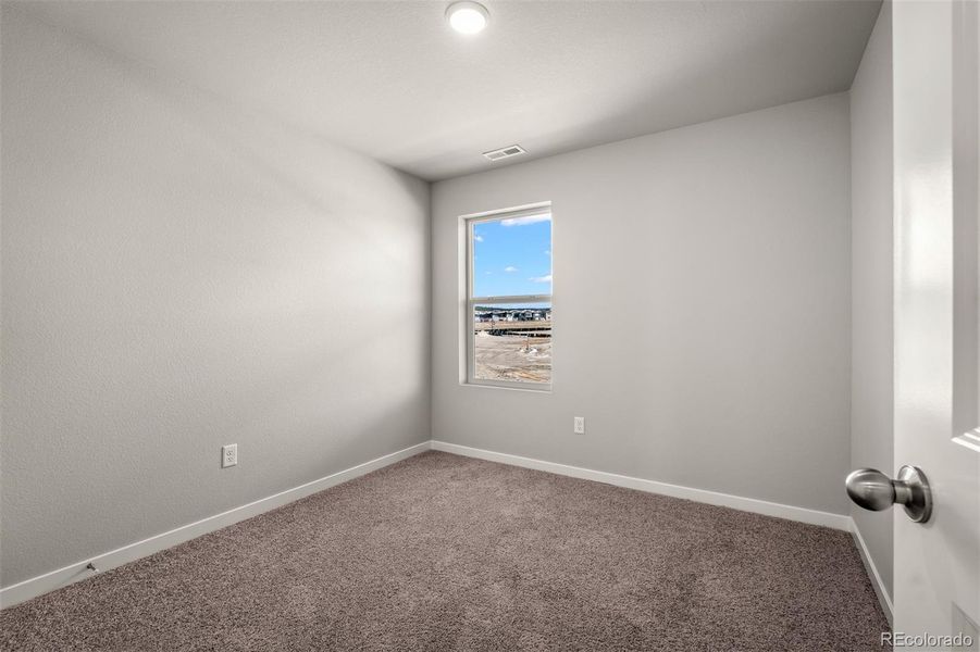 Spacious, unfurnished interior of a new home in Revel Crossing at Wolf Ranch – The Ascent Collection, Colorado Springs (Image 27).