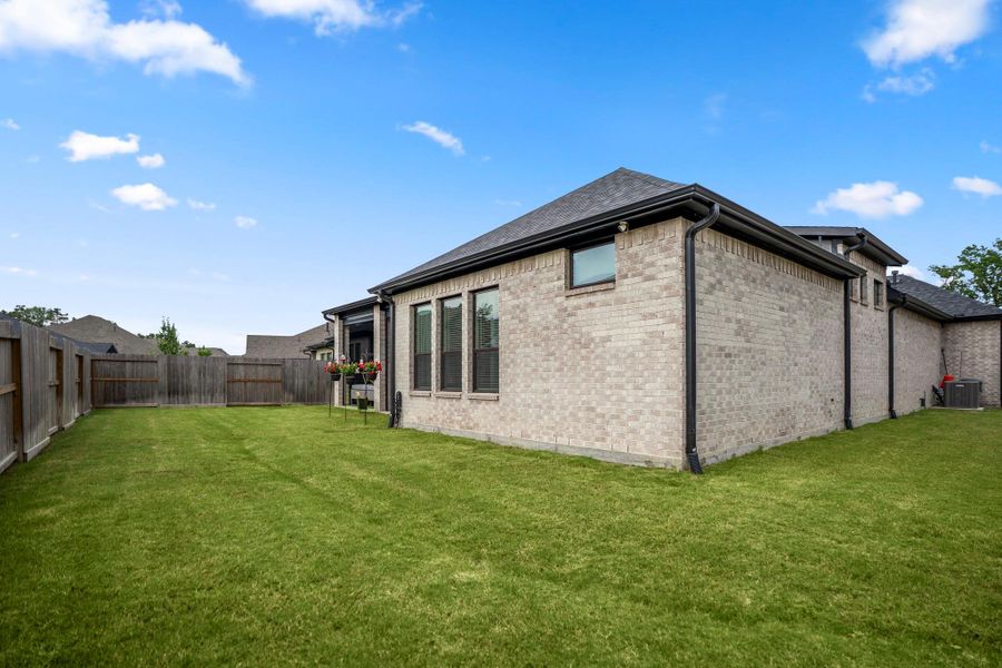 Exterior details and patio area of a home in The Highlands - 65', Porter (Image 26).