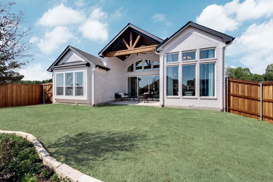 Exterior details and patio area of a home in Justin Crossing, Justin (Image 3).