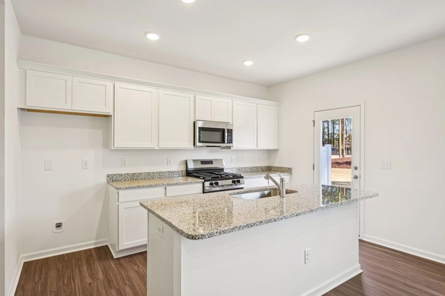 Furnished interior view inside a new home in Towns at Crescent Mills, Wilson's Mills (Image 1). Furnished interior view inside a new home in Towns at Crescent Mills, Wilson's Mills (Image 1).