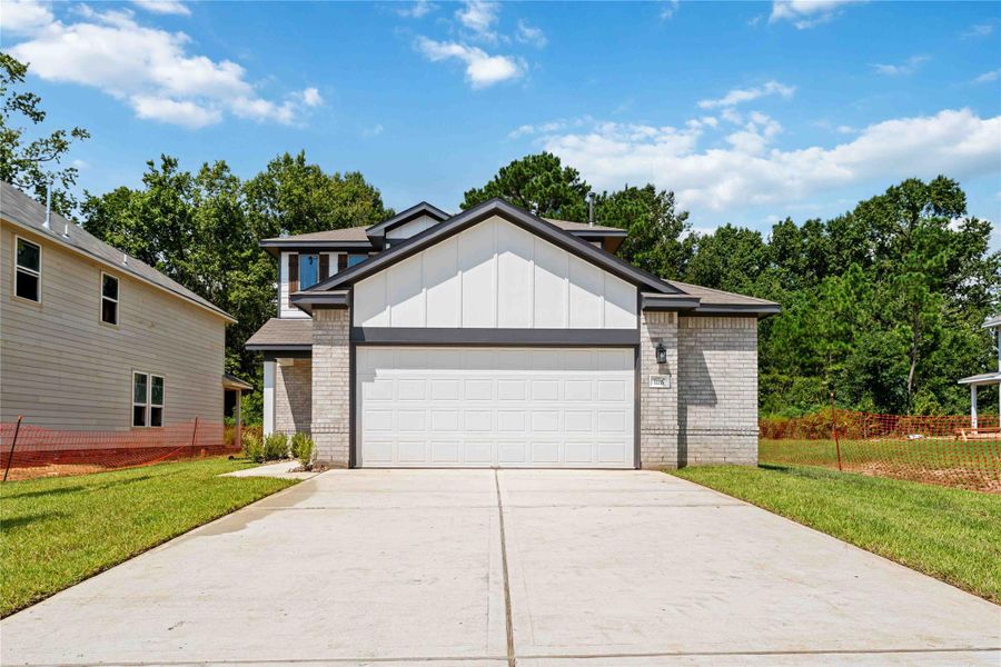 Front exterior of a new home in Lexington Heights, Willis, TX, highlighting curb appeal (Image 2).