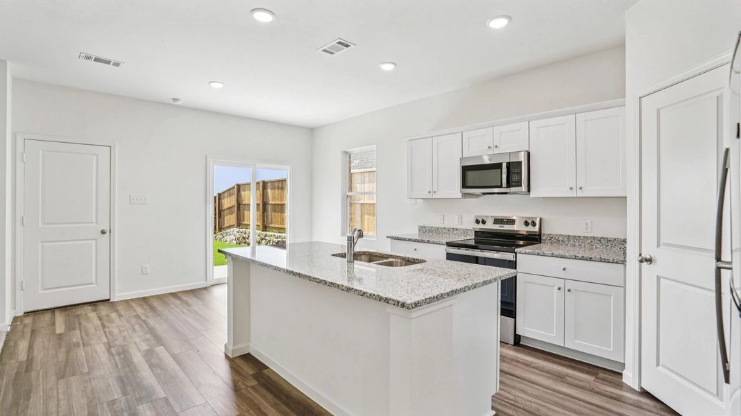 Representative furnished interior of a home built from the Jupiter by Starlight Homes in Brookshire at Legacy Hills, Celina (Image 6).