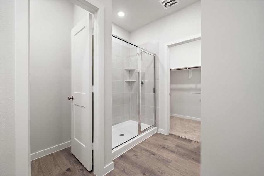 A bathroom with a glass shower.