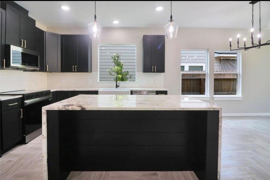 Experience elegance with quartzite countertops and exquisite finishes.