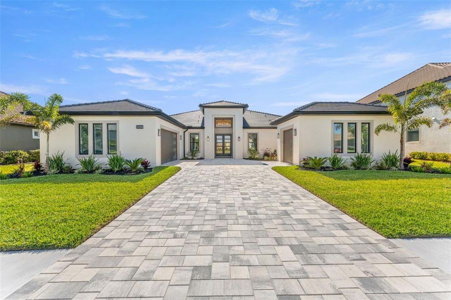Front exterior of a new home in , Wesley Chapel, FL, highlighting curb appeal (Image 1). Front exterior of a new home in , Wesley Chapel, FL, highlighting curb appeal (Image 1).