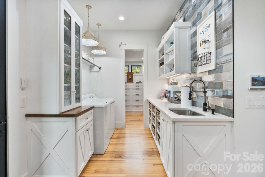 Designed for function and practicality this laundry room has everything you need. Plus, connects to one of the 2 closets in from the primary bedroom Designed for function and practicality this laundry room has everything you need. Plus, connects to one of the 2 closets in from the primary bedroom