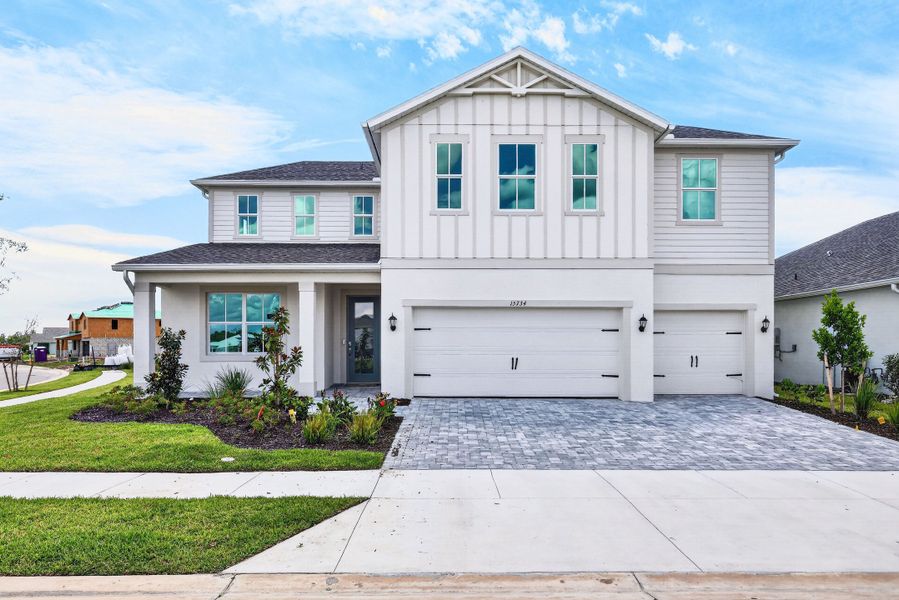 Representative exterior photo of a completed home built from the Jasper by William Ryan Homes in The Sanctuary – Royal Collection, Punta Gorda, FL (Image 10).