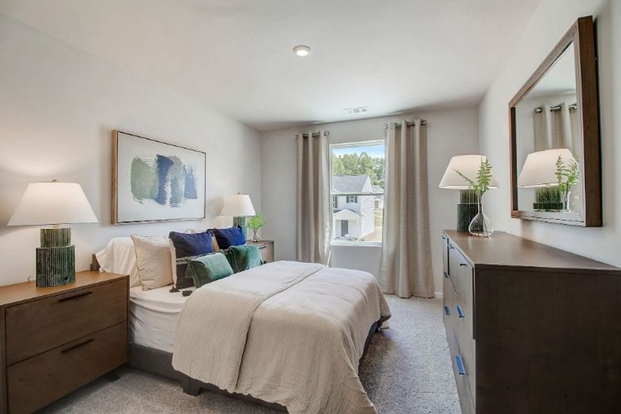 A bedroom with a large mirror. A bedroom with a large mirror.