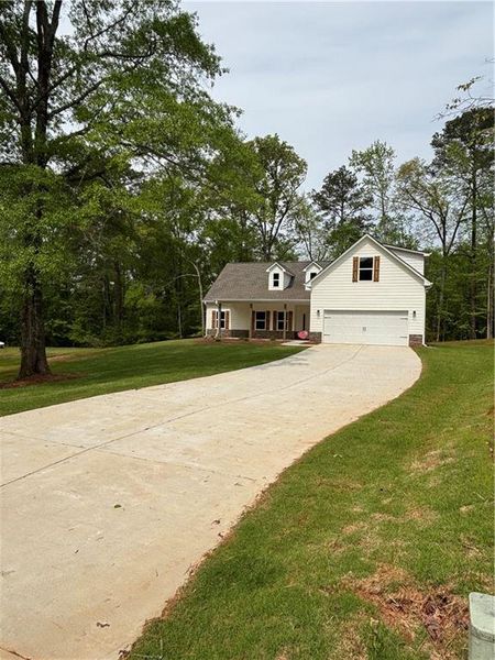 Front exterior of a new home in , Covington, GA, highlighting curb appeal (Image 1). Front exterior of a new home in , Covington, GA, highlighting curb appeal (Image 1).
