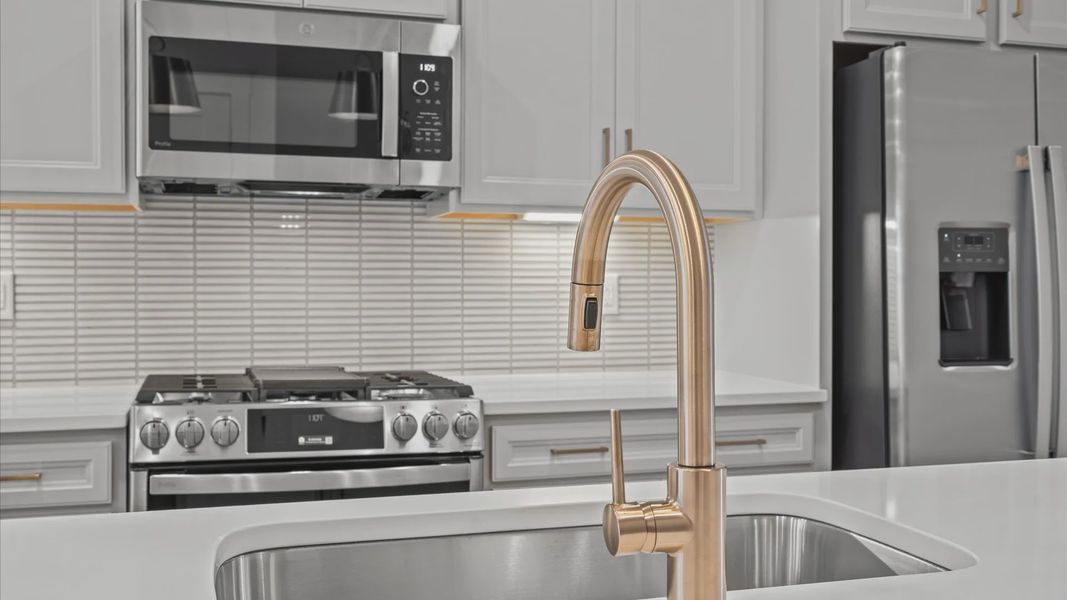 Memorable meals begin in this vibrant kitchen with pendant lighting and a thoughtfully designed island in Greenville, SC