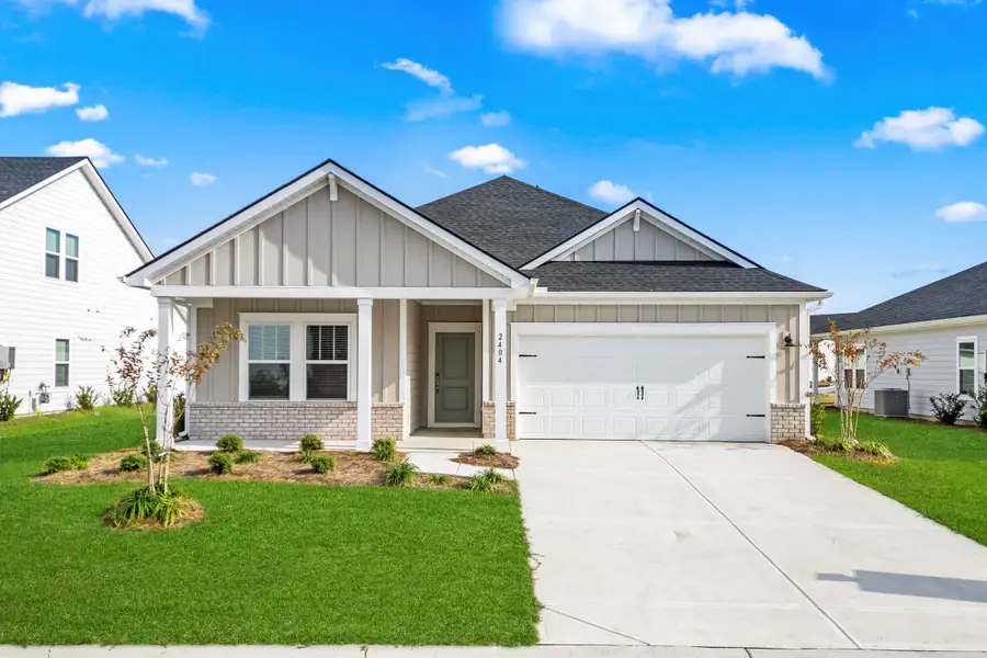 Front exterior of a new home in Cypress Ridge - The Coastline Series, Longs, SC, highlighting curb appeal (Image 1). Front exterior of a new home in Cypress Ridge - The Coastline Series, Longs, SC, highlighting curb appeal (Image 1).