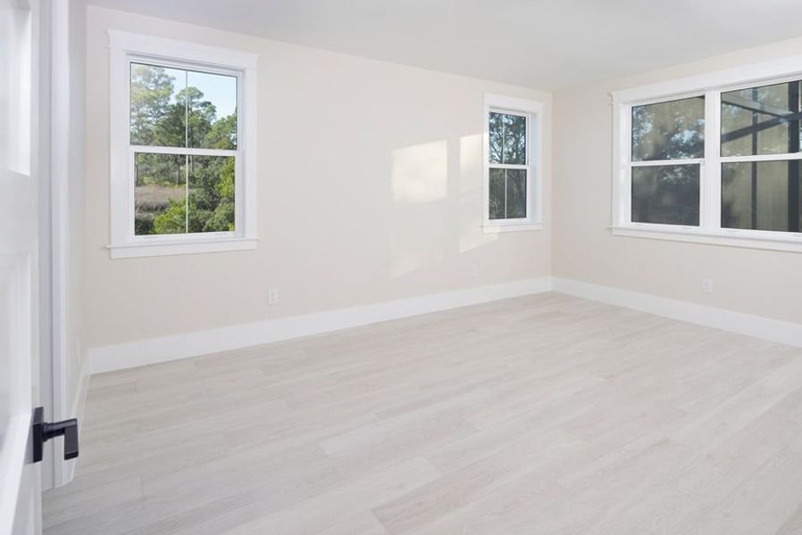 Representative unfurnished interior of a home built from the Grand Wayfarer by Minto Communities in Latitude Margaritaville Watersound, Panama City Beach (Image 21).