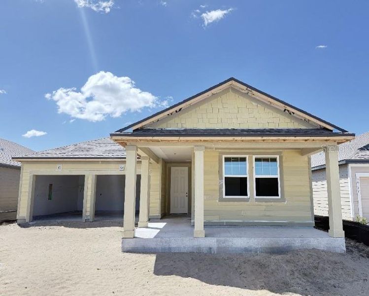 Front exterior of a new home in Trailside, Mount Dora, FL, highlighting curb appeal (Image 1). Front exterior of a new home in Trailside, Mount Dora, FL, highlighting curb appeal (Image 1).