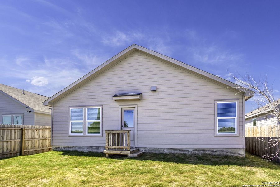 Front exterior of a new home in , Bulverde, TX, highlighting curb appeal (Image 2).