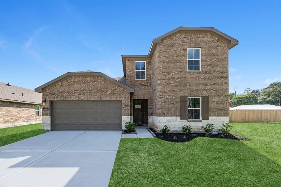 Front exterior of a new home in Springwood, Beaumont, TX, highlighting curb appeal (Image 23).