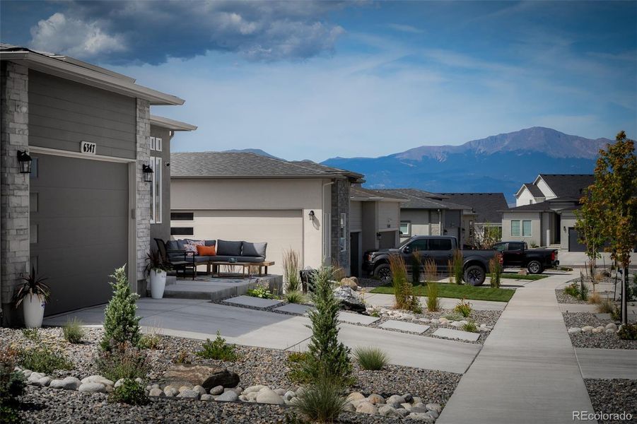 Front exterior of a new home in , Colorado Springs, CO, highlighting curb appeal (Image 22).