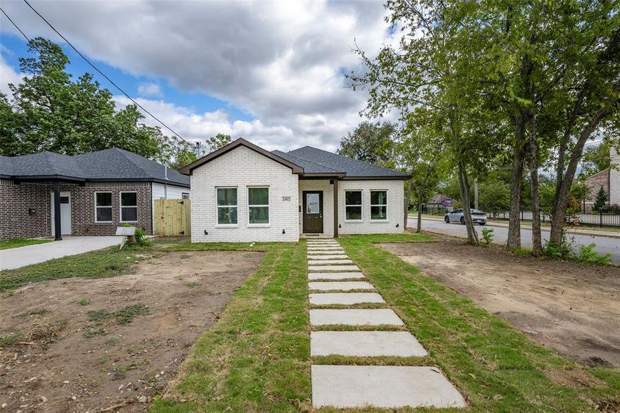 View of front of property featuring brick siding