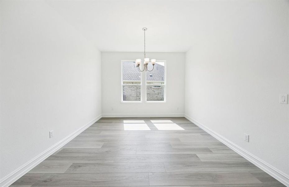 Formal dining room with large windows
