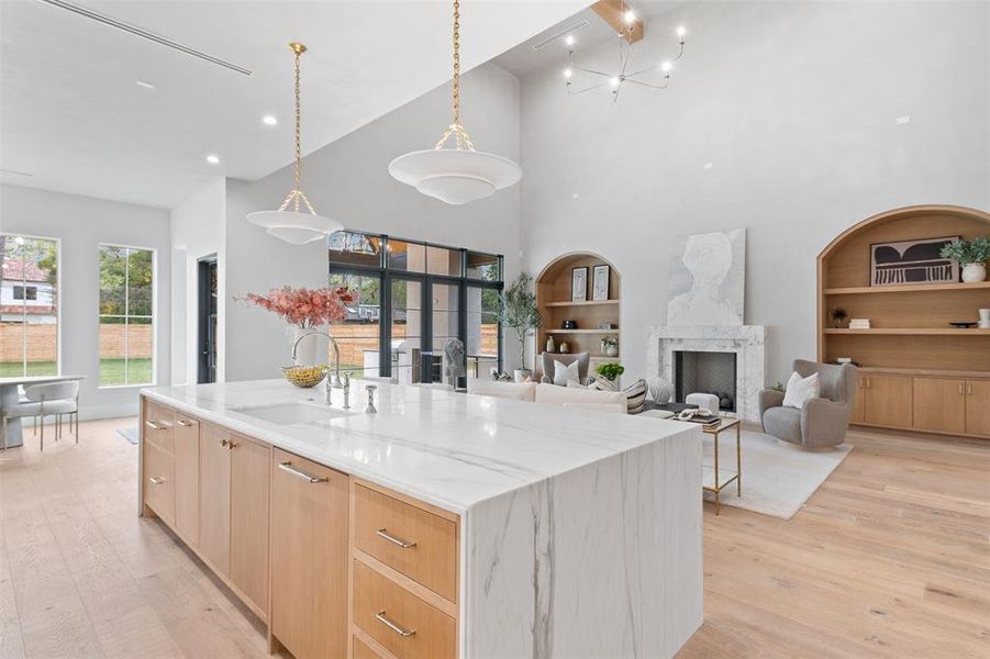 Captivating one-of-a-kind waterfall kitchen island.