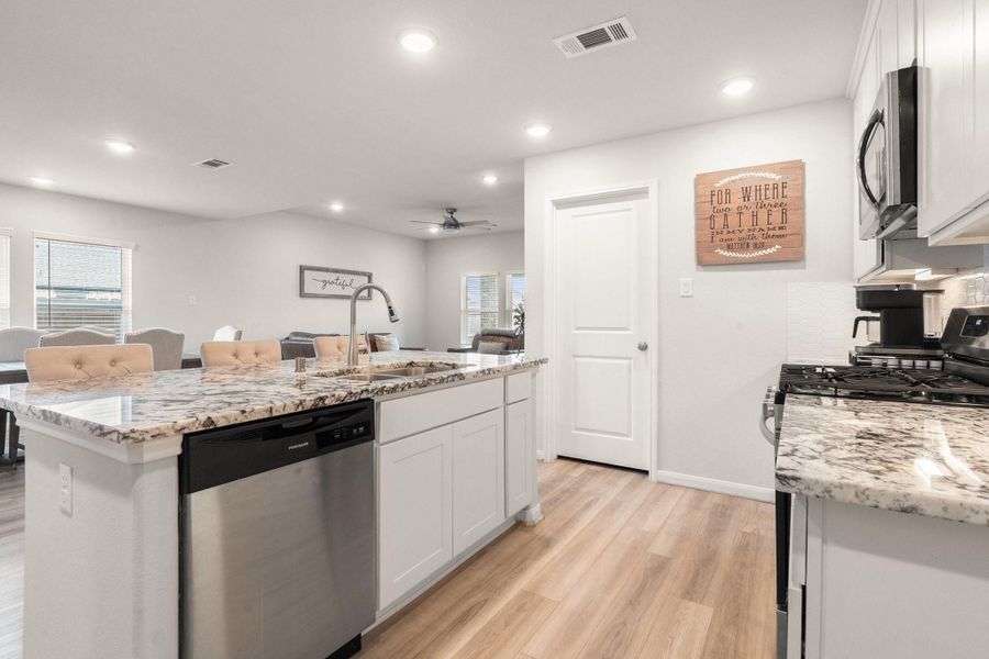 Stainless appliances add to the contemporary look. Stainless appliances add to the contemporary look.