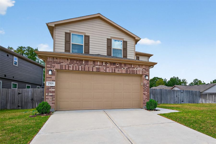 Front exterior of a new home in Creekside Court, Magnolia, TX, highlighting curb appeal (Image 21). Front exterior of a new home in Creekside Court, Magnolia, TX, highlighting curb appeal (Image 21).
