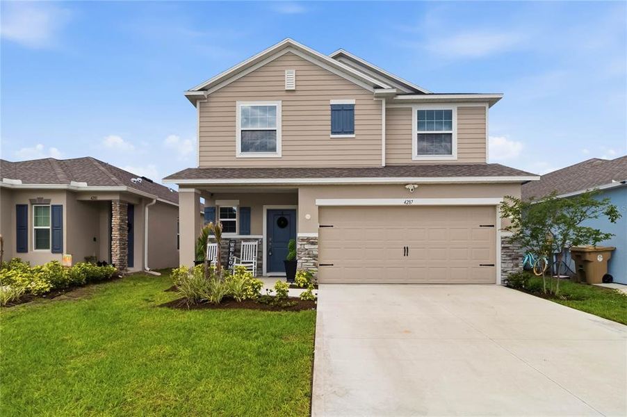 Front exterior of a new home in , St. Cloud, FL, highlighting curb appeal (Image 27).