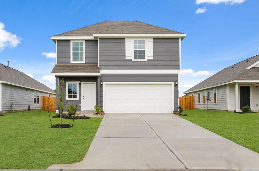 Front exterior of a new home in Townsend Reserve, Splendora, TX, highlighting curb appeal (Image 1). Front exterior of a new home in Townsend Reserve, Splendora, TX, highlighting curb appeal (Image 1).