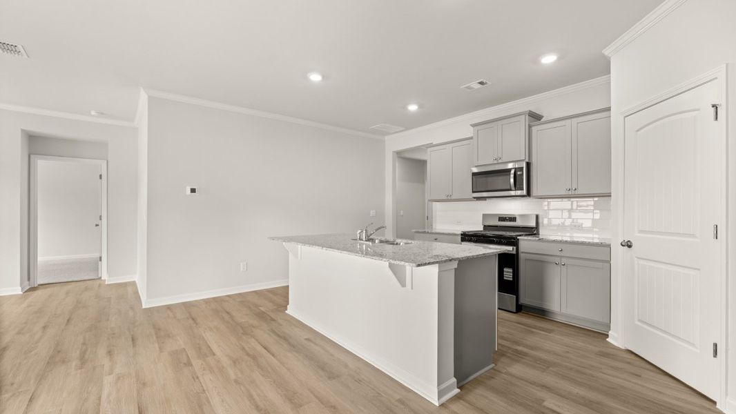 Representative furnished interior of a home built from the Cali by D.R. Horton in Sheffield Highlands, Dallas (Image 9).