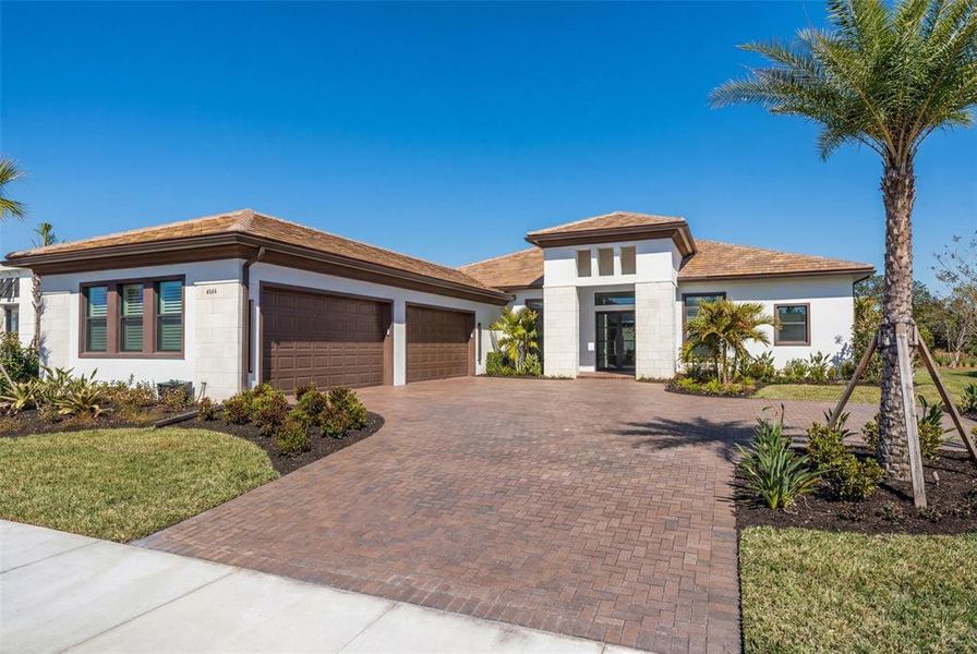 Front exterior of a new home in , Sarasota, FL, highlighting curb appeal (Image 32).