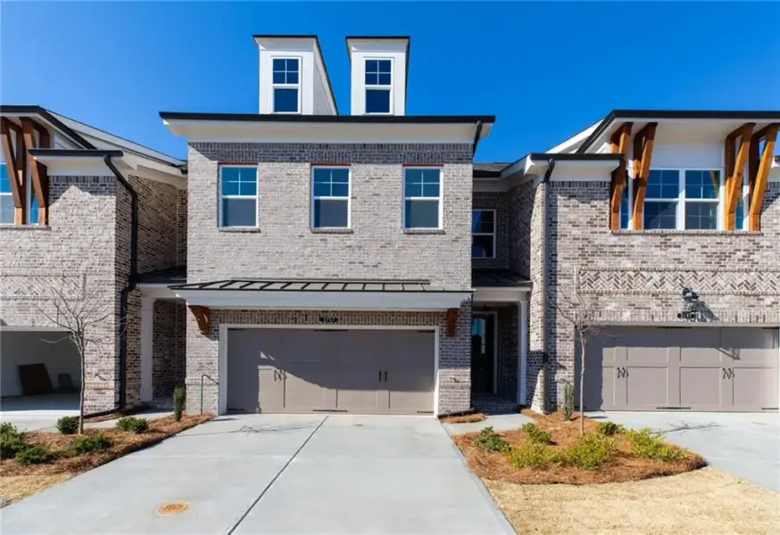Front exterior of a new home in Oakcrest, Duluth, GA, highlighting curb appeal (Image 1). Front exterior of a new home in Oakcrest, Duluth, GA, highlighting curb appeal (Image 1).