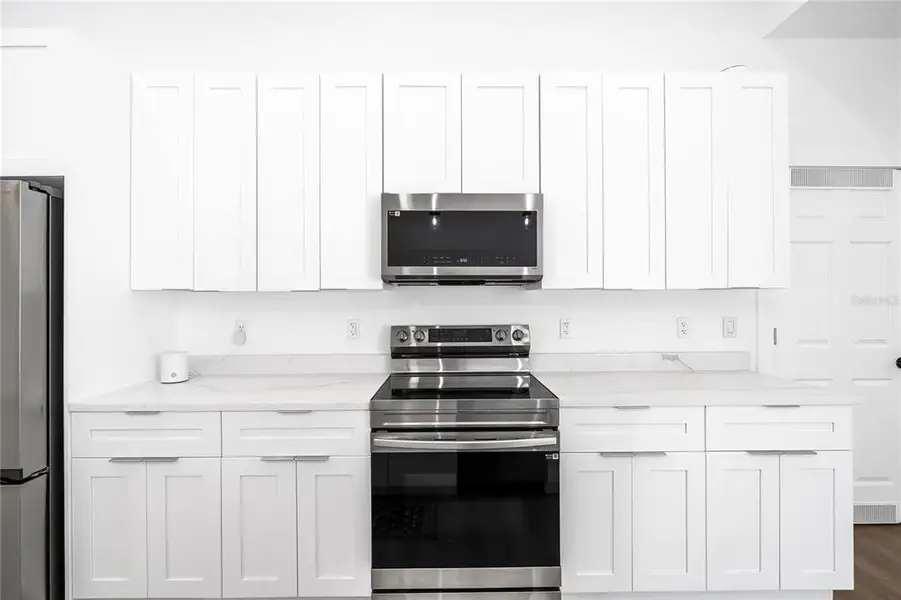 Furnished interior view inside a new home in , Clewiston (Image 8).