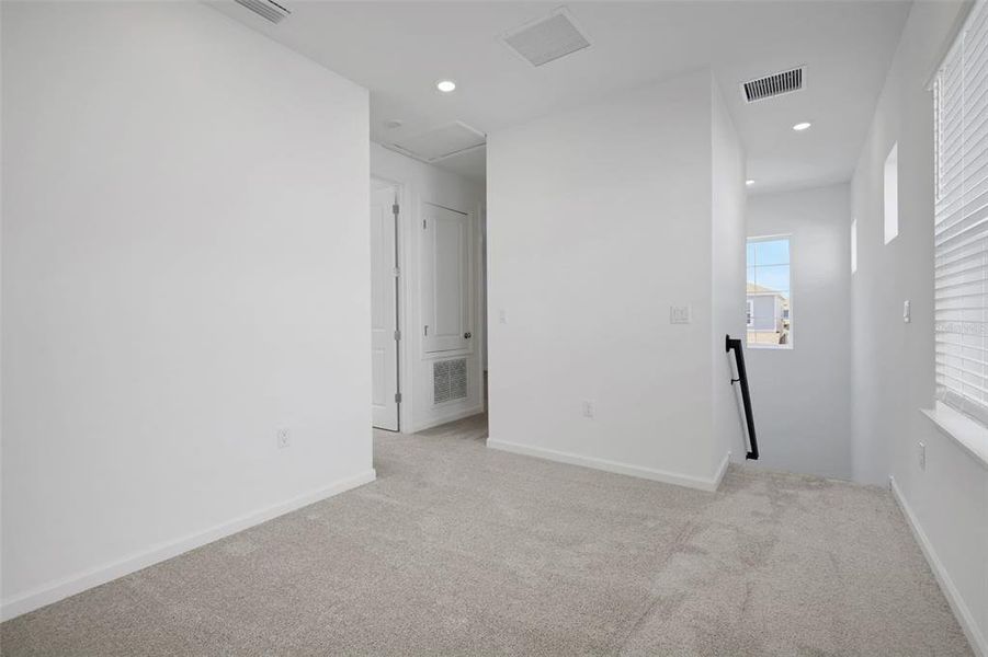 Spacious, unfurnished interior of a new home in Serenade at Ovation, Winter Garden (Image 25).