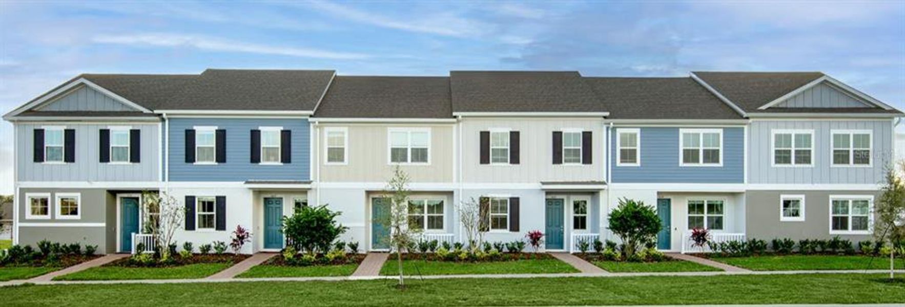 Front exterior of a new home in The Residences at Emerson Park, Apopka, FL, highlighting curb appeal (Image 1). Front exterior of a new home in The Residences at Emerson Park, Apopka, FL, highlighting curb appeal (Image 1).