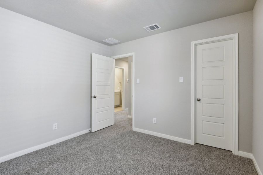 Guest bedroom in the Medina floorplan at a Meritage Homes community.