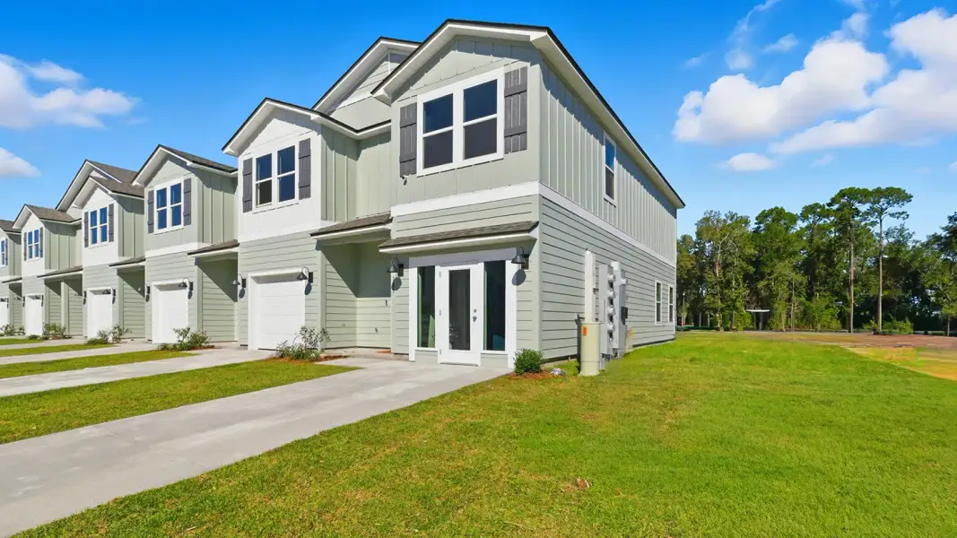 Front exterior of a new home in Abilene Acres, Tallahassee, FL, highlighting curb appeal (Image 25).