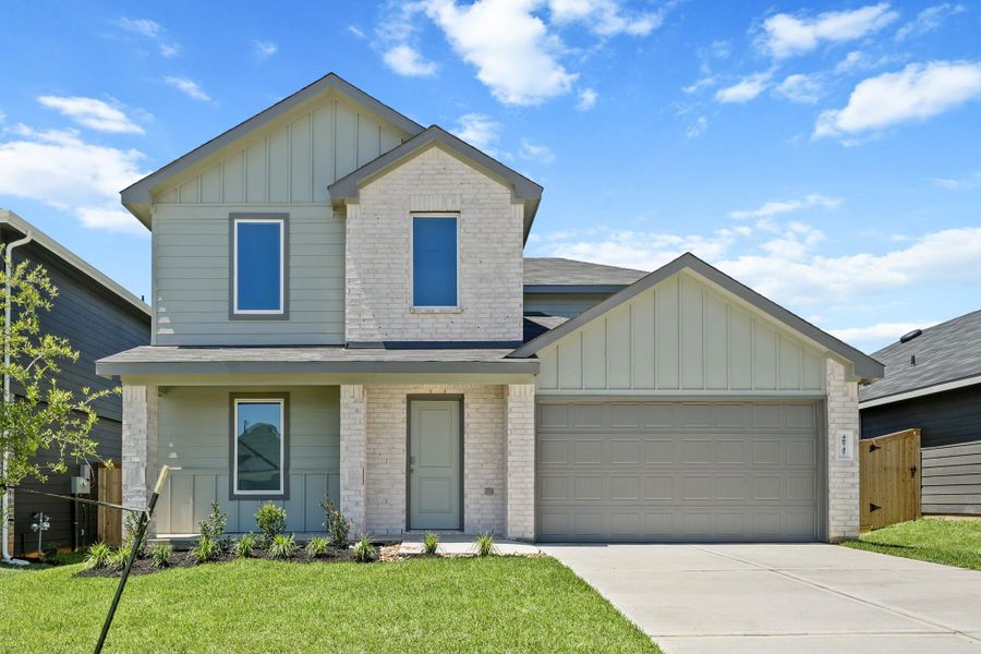 Front exterior of a new home in Mill Creek, Magnolia, TX, highlighting curb appeal (Image 2). Front exterior of a new home in Mill Creek, Magnolia, TX, highlighting curb appeal (Image 2).