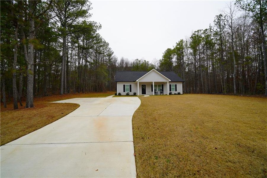 Front exterior of a new home in , Bremen, GA, highlighting curb appeal (Image 2).