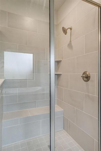 Bathroom featuring a shower with door