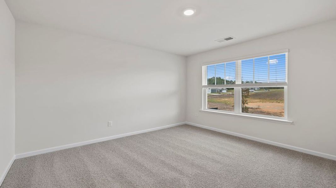 Spacious, unfurnished interior of a new home in Bentley Park, Greenwood (Image 24).