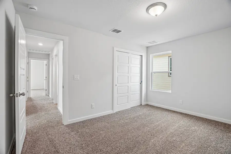 Spacious, unfurnished interior of a new home in The Meadows at Hunters Ranch, San Antonio (Image 34).